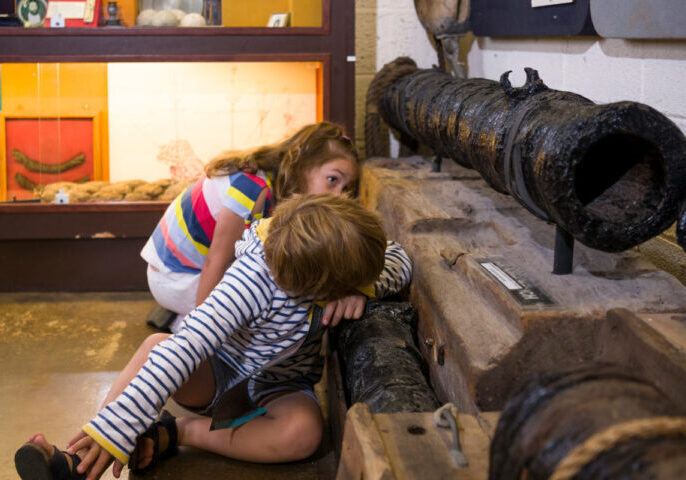 Children-eye-spy-the-cannons-at-Shipwreck-Museum-Charlestown-Cornwall-1600x800